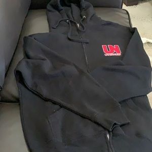 Unheardof black hoodie with red logo.